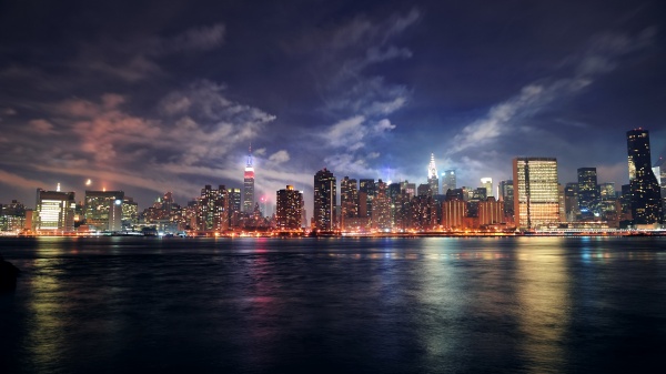 How do PTZ cameras with Intelligent Auto-Tracking decrease manual adjustments in security systems?